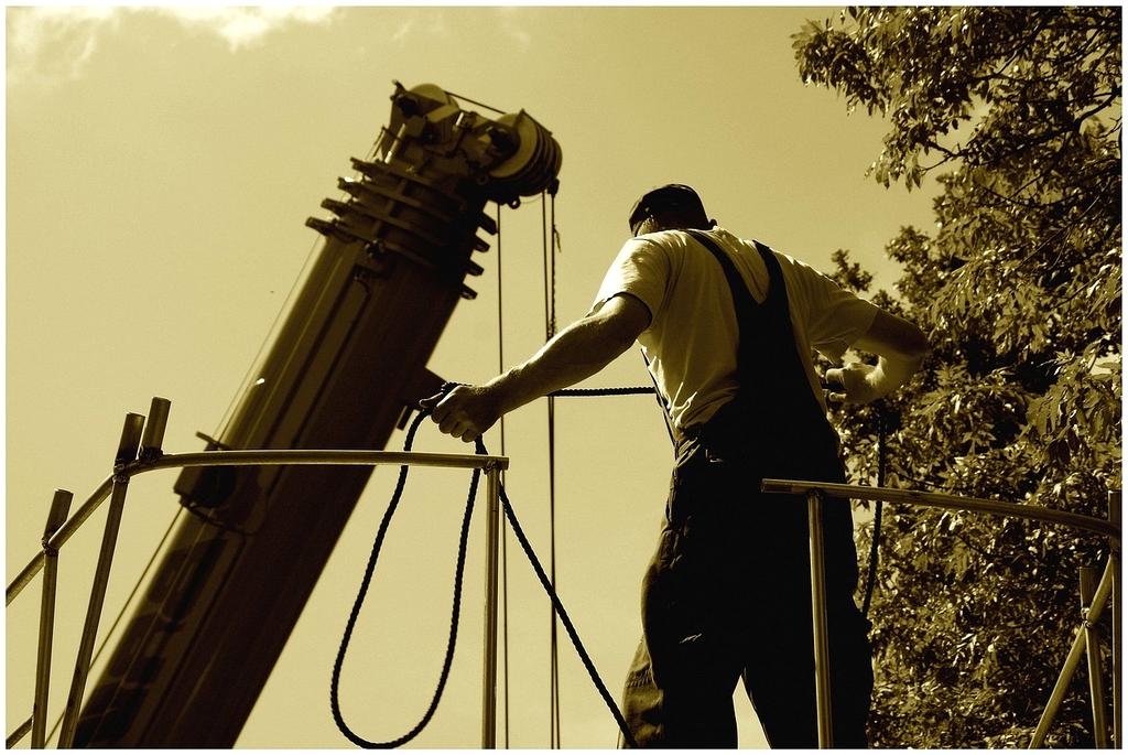 Emergency electrical repair technician working on power restoration during urgent electrical maintenance